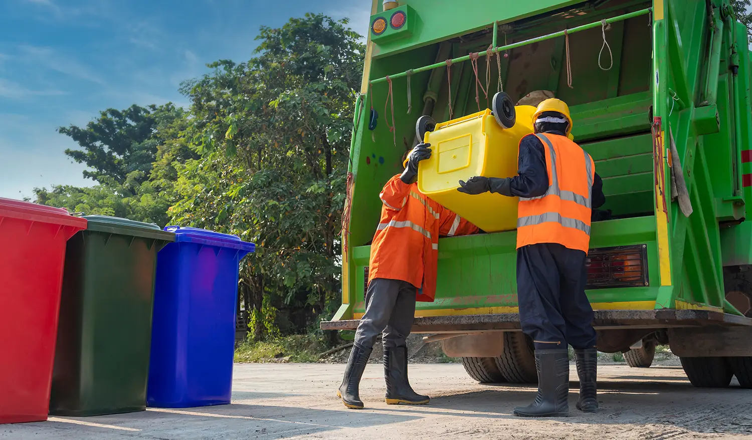 Professional waste management services in Dubai UAE with collection trucks